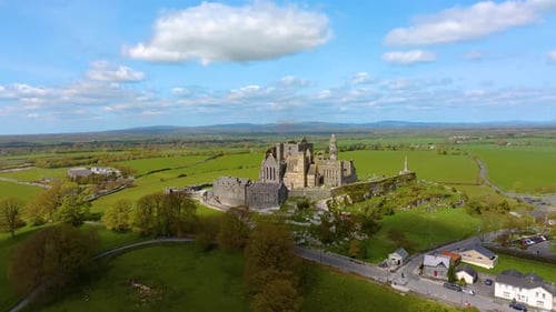 Aerial view of the Rock of Cashel, capturing ancient stone walls, round towers, and cathedral ruins