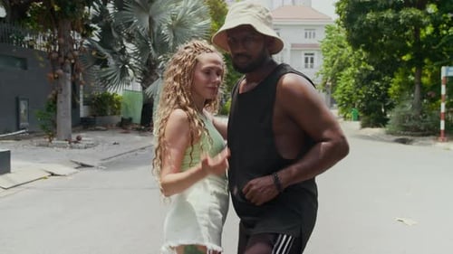 Couple Dancing on Tropical City Street During Daytime