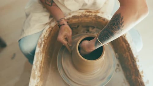 Potter Creating Clay Pot in Workshop, Close Up