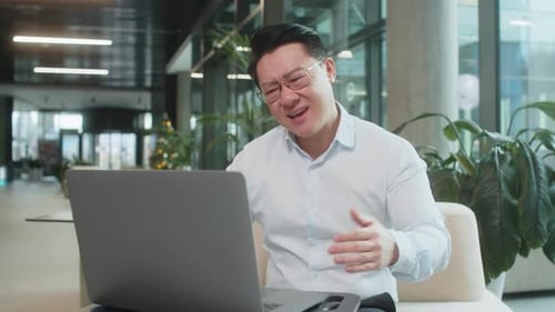 Sad Businessman Using Laptop Loses Becoming Shocked Sudden Lottery Results in Modern Hotel Lobby