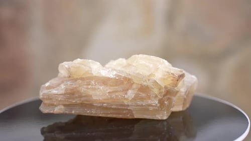 Translucent Crystal Rotating on Platform Close Up