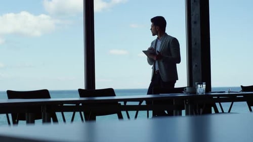 Executive Tablet Research in Dark Office