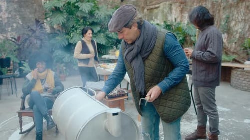 Friends Gathering for Outdoor Barbecue in Urban Setting