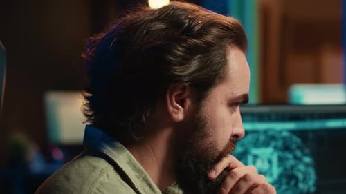 IT Expert Programming to Upgrade AI Brain Close Up on Face Expressions