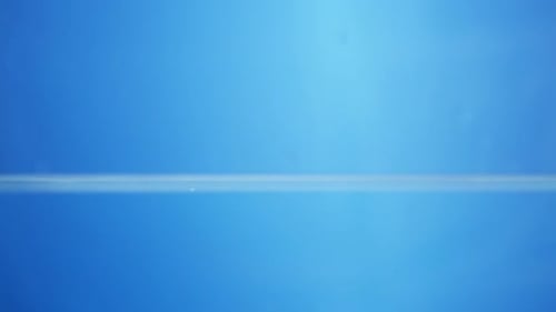 Water Droplet Splashing On Blue Background