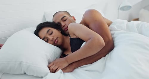 Romantic Couple Sleeping Peacefully in Bed Together