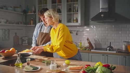 Couple Cooking Fresh Vegetables Together in Kitchen