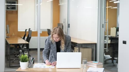 Professional Woman Reviewing Market Data