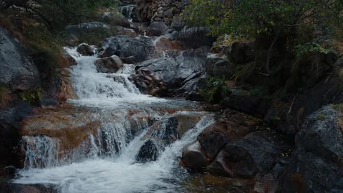 Beautiful Mountain River with Cascades Flowing on Rocks in Slow Motion