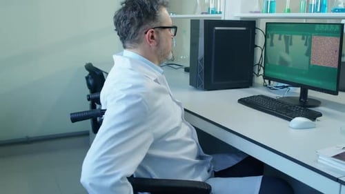 Scientist in Wheelchair Working in Lab