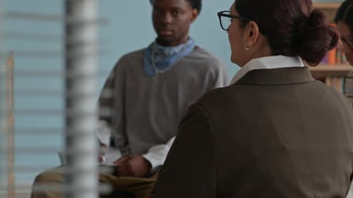 Diverse Group Discussing Ideas in a Modern Office