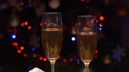 Champagne Celebration by Christmas Tree Lights