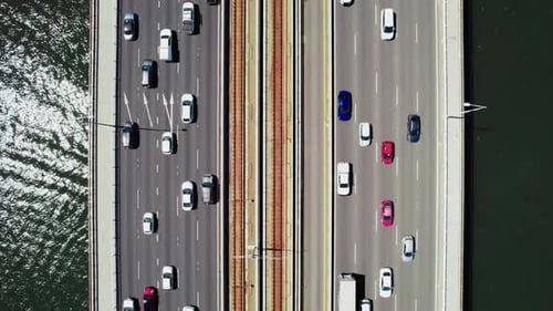 Aerial View of Traffic Flowing on a Bridge