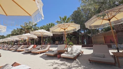 Luxury Beach Club Sunbeds and Boho Umbrellas Cinematic