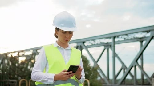 Supervisor Woman Analysing Work at Bridge Construction Brunette Industrial Engineer Holding Digital