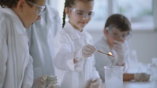 Children Doing Science Experiment in Classroom Lab