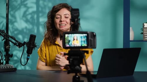 Young Woman Records Video with Technology