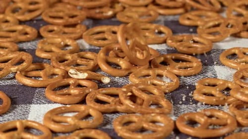 Pretzels Falling onto Blue and White Checkered Surface