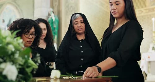 Funeral, church or family by casket with flowers at memorial service for respect