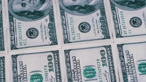 Rows of crisp new hundred dollar bills