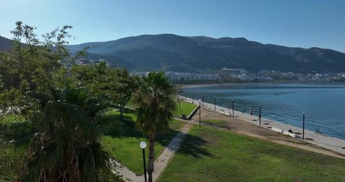 Aerial view of the waterfront promenade and mountains of Vlore, Albania on a sunny day