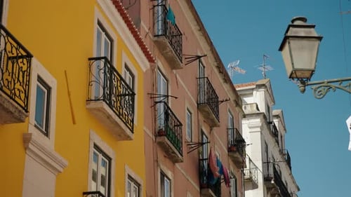 Hanging Laundry On Apartment Balcony In Lisbon, Portugal. Tracking Shot