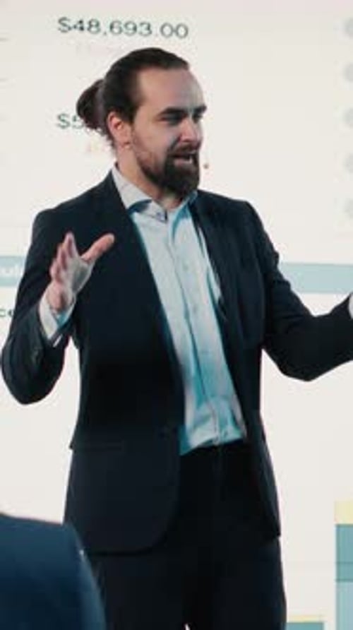 Man Gives Presentation on Business Financial Data