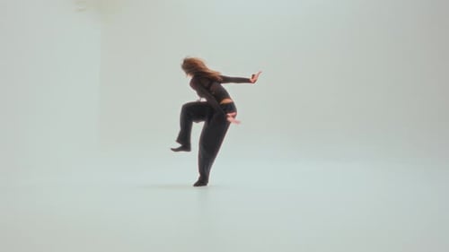 Stylish Woman Dancing in a Studio