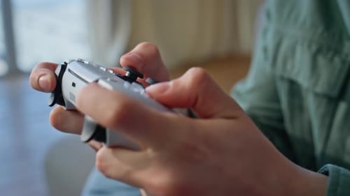 Man Playing Video Game with Controller Close Up
