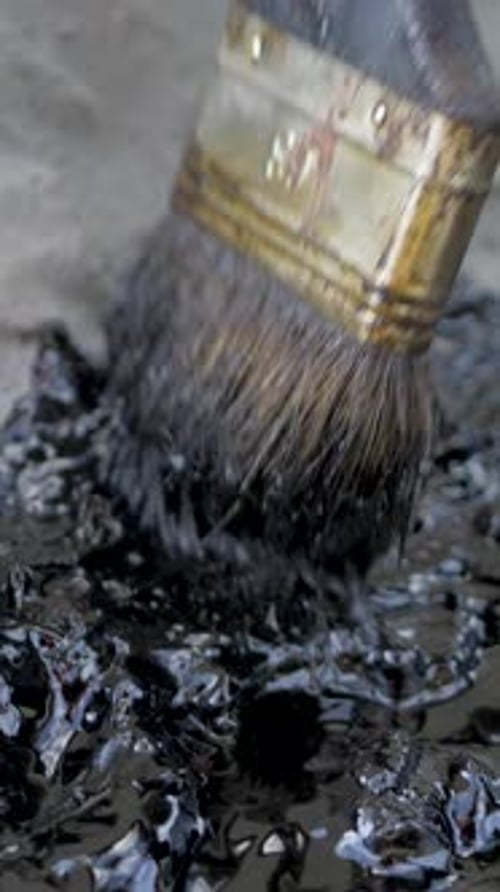 Applying Black Sealant with a Brush, Close Up