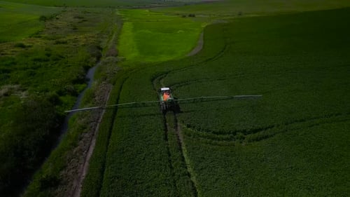 Spray Fertilize On Field With Chemicals In Agriculture Field
