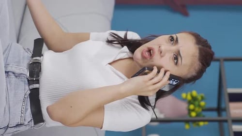 Angry Woman Arguing on Phone While Lying Down