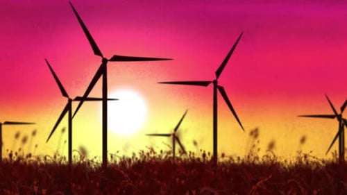 Wind Turbines in Silhouette Against Vibrant Sunset Background