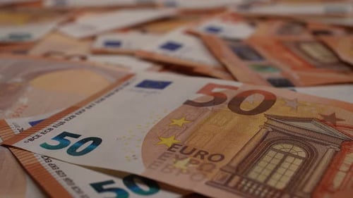 Pile of orange 50 Euro bills