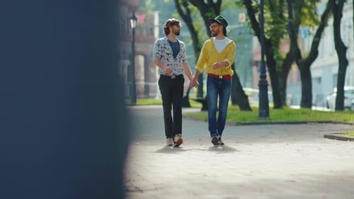 Affectionate Couple Walking Hand-in-Hand in City Park