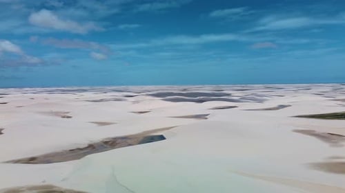 Aerial pan shot of sandy desert of Lencois Maranhenses national park, Brazil