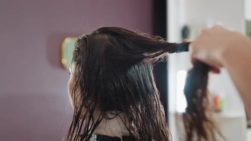 Woman Getting Haircut Wet Hair in Beauty Salon