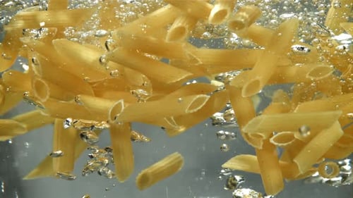 Penne Pasta Falls Into Boiling Water Filmed on a Highspeed Camera at 1000 Fps