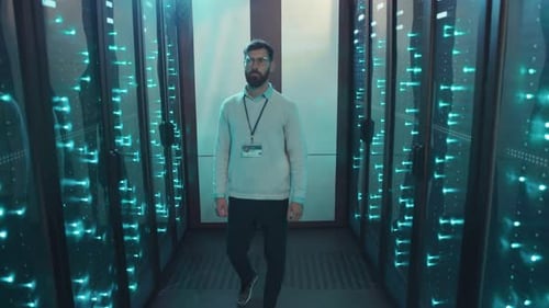 A Skilled Technologist Works Diligently in a Server Room with Advanced Hightech Equipment