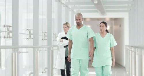 Surgeons walking through a hospital