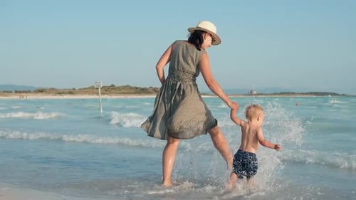 Woman and child enjoy beach vacation on sunny day