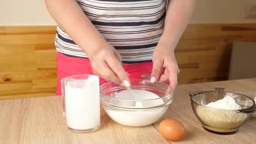 Woman Preparing Ingredients for a Recipe in Kitchen