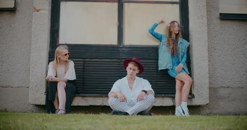 Stylish Young Adults Posing in Urban Setting