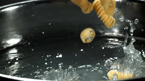 Fusilli Pasta Falls Into Boiling Water Filmed on a Highspeed Camera at 1000 Fps