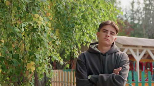 Teen with brown hair in the park