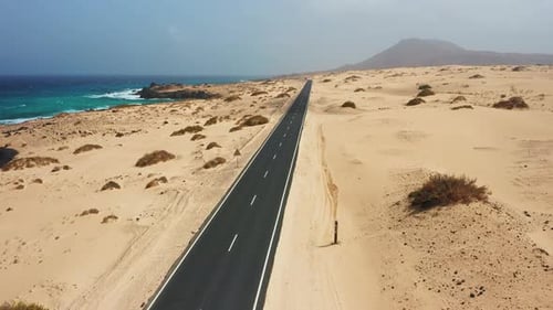 Aerial Drone View of Atlantic Ocean Coastline Asphalt Road Along the Coast Beach Playa Alzada Surf