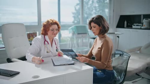 Healthcare Patient Holding Xray at Medical Consultation in Clinic with Doctor