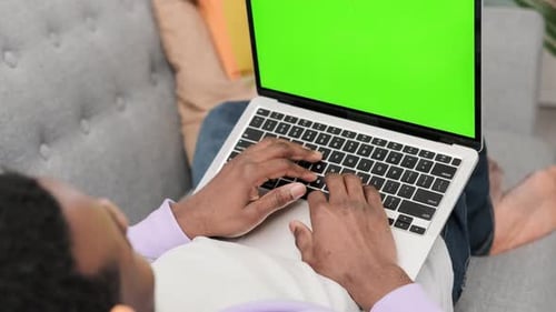 Black Man Using Laptop Notebook Viewing Green Screen Press Keyboard Browsing Chroma Key African