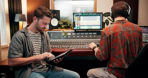 Sound engineer, team and tablet in studio for music, production and collaboration with equipment