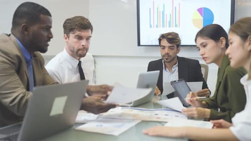Close up shot group of multiethnic business team sit and discuss the project in the conference room